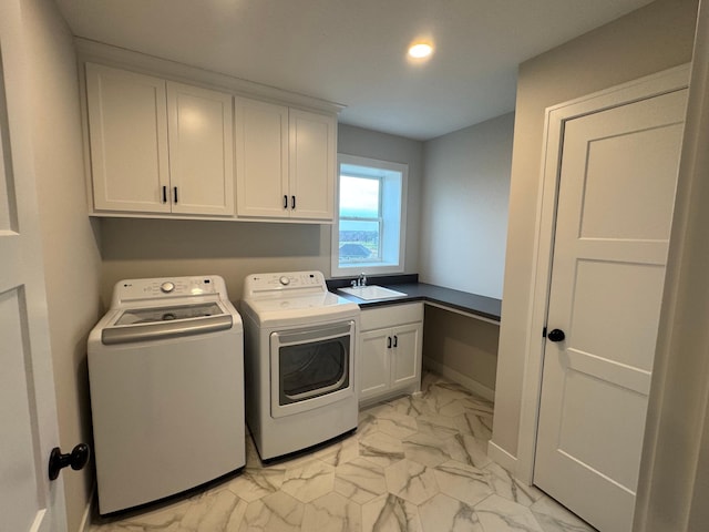 laundry room with light marble finish flooring, cabinet space, washer and clothes dryer, and recessed lighting