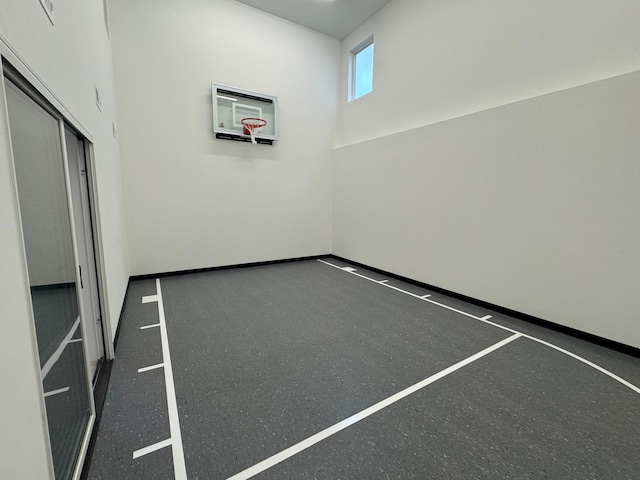 view of sport court with basketball hoop