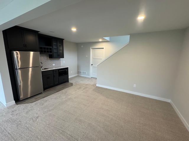 14526 Kingsview Ln N, Dayton, MN 55327 - kitchen featuring freestanding refrigerator, light colored carpet, baseboards, decorative backsplash, and recessed lighting