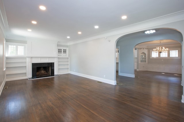 unfurnished living room featuring ornamental molding, plenty of natural light, and dark hardwood / wood-style floors