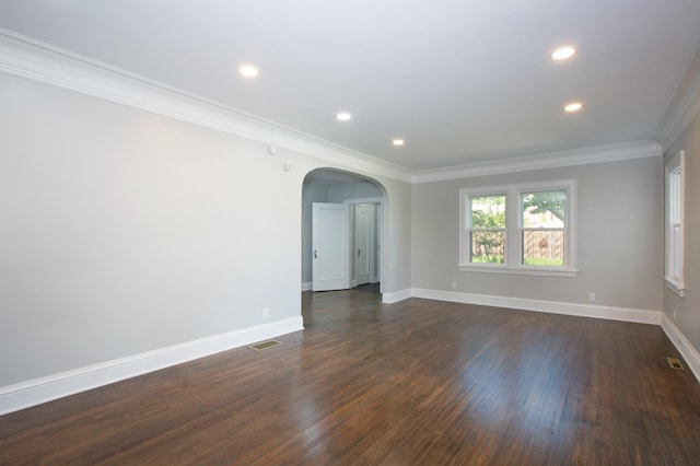 empty room with dark hardwood / wood-style floors and ornamental molding