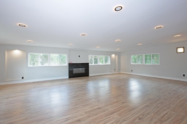 unfurnished living room with light hardwood / wood-style floors