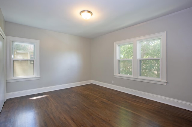 spare room featuring dark hardwood / wood-style floors