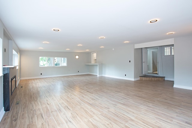 unfurnished living room featuring light hardwood / wood-style flooring