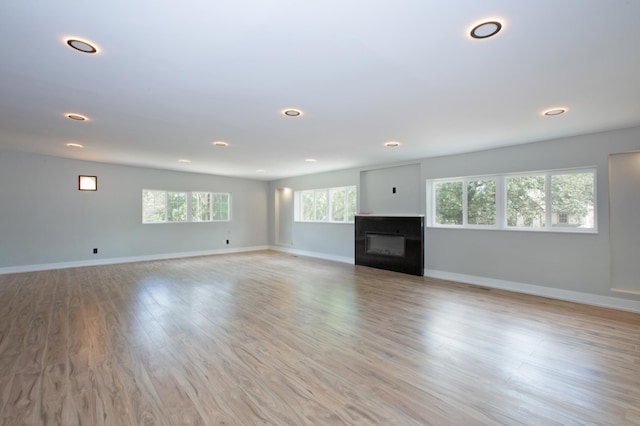 unfurnished living room featuring light wood-type flooring