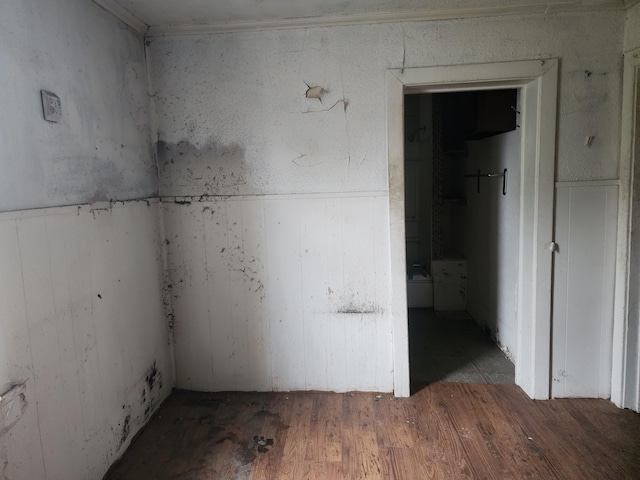 unfurnished room with wood-type flooring