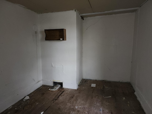 empty room featuring dark hardwood / wood-style flooring