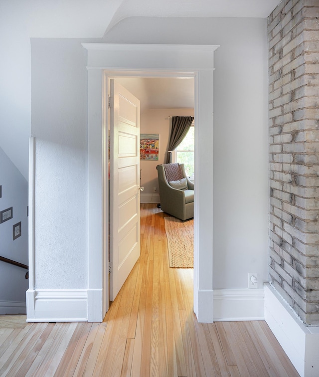 hallway with light wood-type flooring