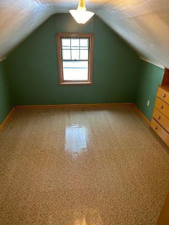 bonus room featuring lofted ceiling