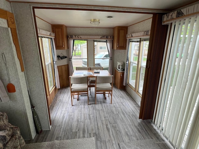 25683 Circle Dr, Garrison Twp, MN 56401 - dining room with wallpapered walls and light wood finished floors