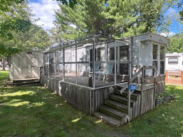 25683 Circle Dr, Garrison Twp, MN 56401 - rear view of property with a yard and a deck