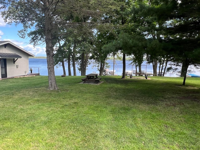 25683 Circle Dr, Garrison Twp, MN 56401 - view of green lawn featuring a water view