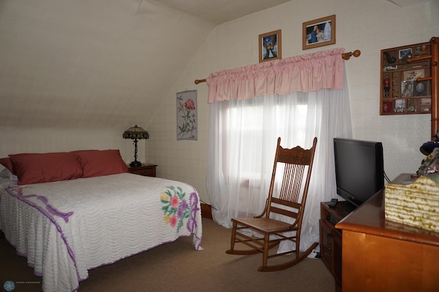 carpeted bedroom with vaulted ceiling