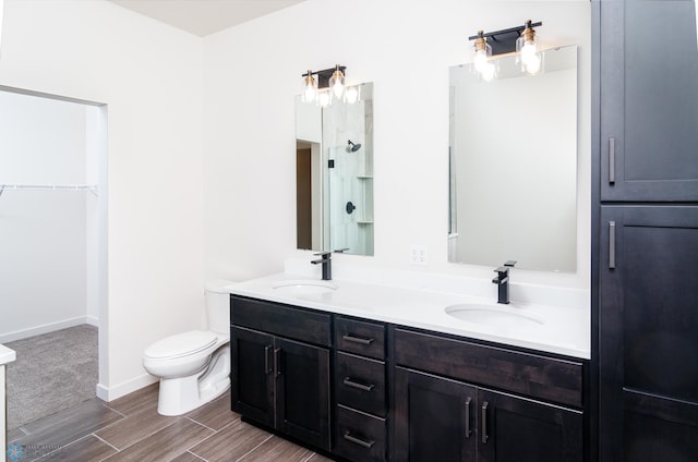 bathroom with toilet and vanity