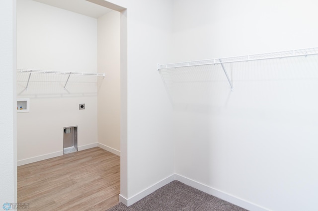 laundry room with hookup for a washing machine, hardwood / wood-style flooring, and hookup for an electric dryer