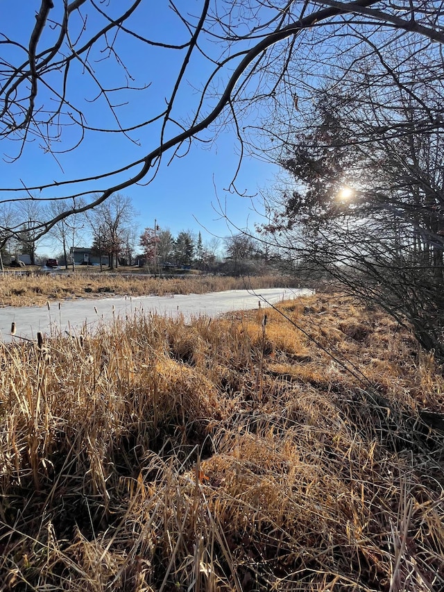 view of yard with a rural view