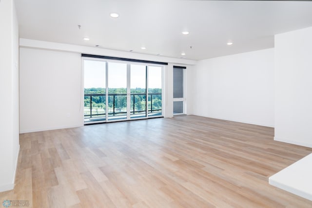 unfurnished room featuring light wood-type flooring