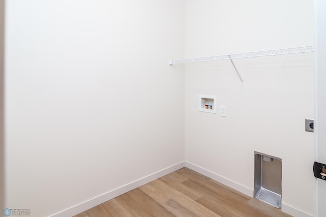 laundry room featuring hookup for a washing machine, hardwood / wood-style flooring, and electric dryer hookup