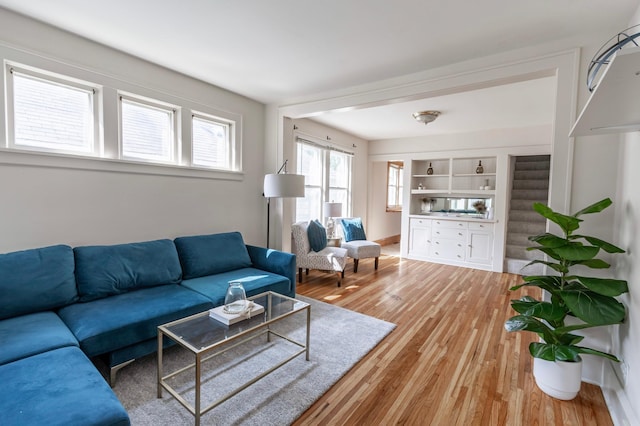 living room with light hardwood / wood-style flooring