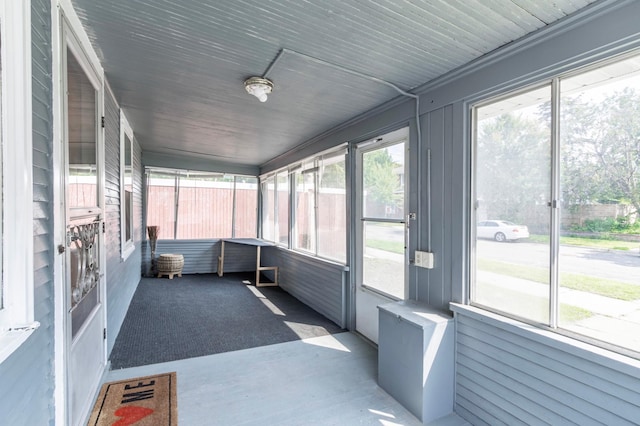 unfurnished sunroom with a wealth of natural light