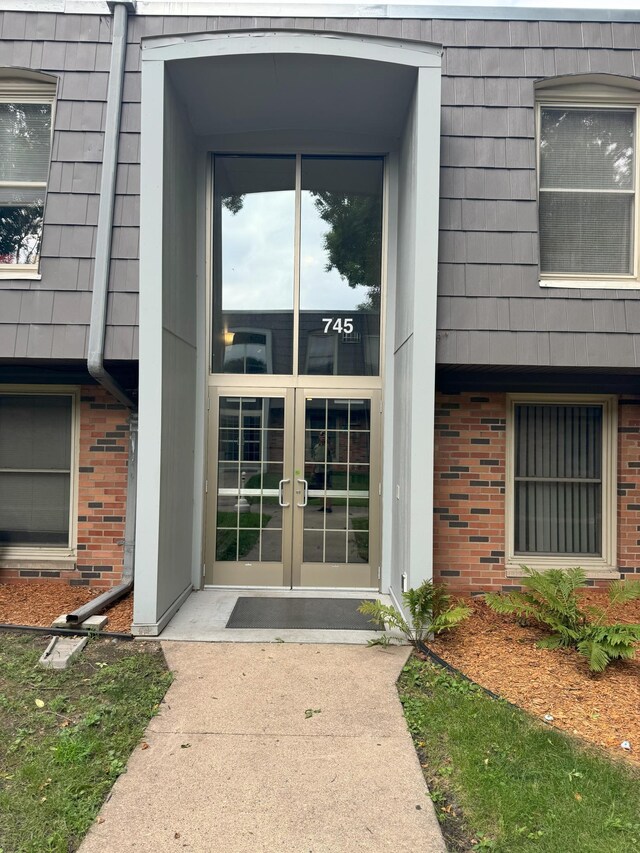 property entrance featuring french doors