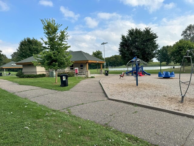 communal playground featuring a yard