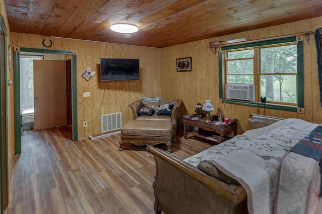 bedroom with wood walls, wood-type flooring, wood ceiling, and cooling unit