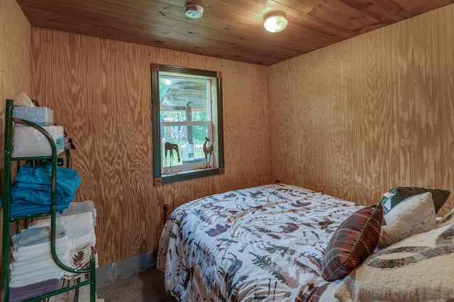 bedroom featuring carpet floors and wooden ceiling