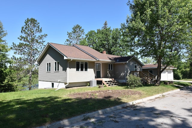 205 2nd Ave SE, Baudette, MN 56623 - ranch-style house featuring a front yard and a chimney