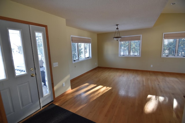 205 2nd Ave SE, Baudette, MN 56623 - foyer featuring light wood-type flooring and a textured ceiling