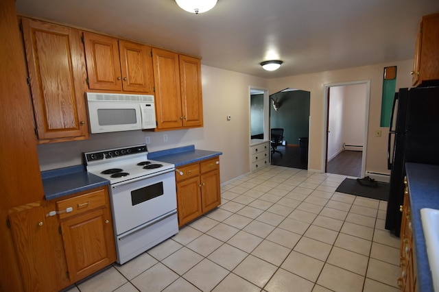 205 2nd Ave SE, Baudette, MN 56623 - kitchen featuring white appliances, baseboard heating, a baseboard heating unit, and brown cabinetry