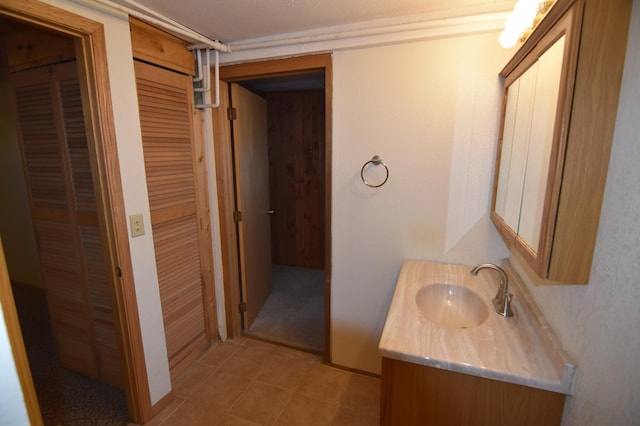 205 2nd Ave SE, Baudette, MN 56623 - bathroom with vanity and tile patterned flooring