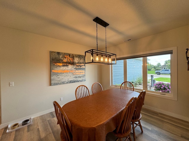 dining space featuring hardwood / wood-style floors