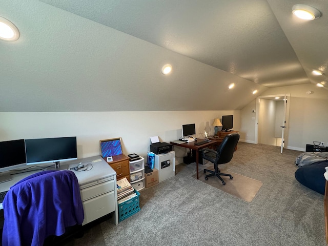 carpeted office space with lofted ceiling and a textured ceiling