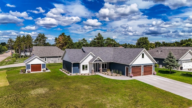 view of front facade with a garage and a front lawn