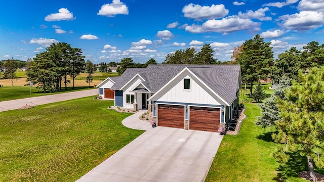 view of front of house with a garage and a front lawn