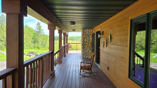 wooden terrace featuring a porch