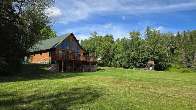 view of yard featuring a wooden deck