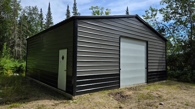 view of outbuilding featuring a garage