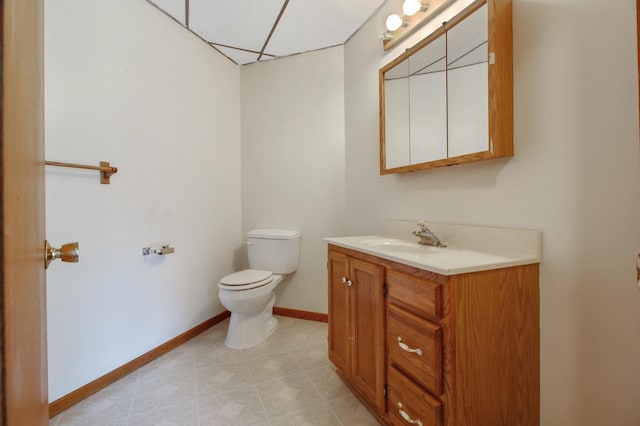 bathroom with tile patterned floors, toilet, and vanity