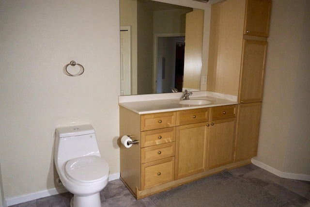 bathroom with tile patterned floors, vanity, and toilet