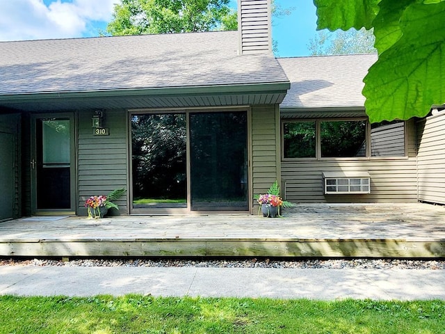 back of house featuring a wooden deck