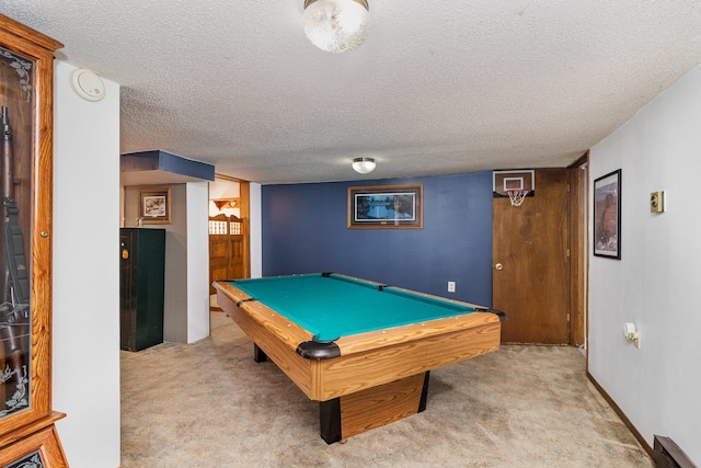 playroom with light colored carpet, a textured ceiling, and billiards