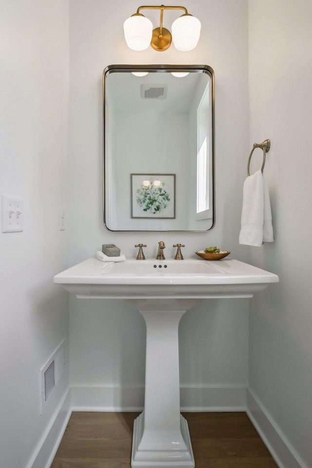 bathroom with wood-type flooring