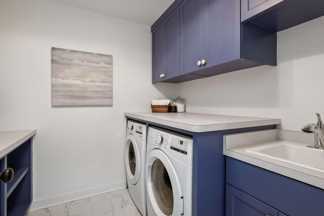 clothes washing area featuring light tile patterned floors, washing machine and dryer, sink, and cabinets