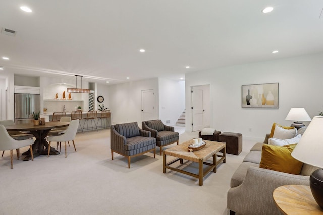 living room with light colored carpet