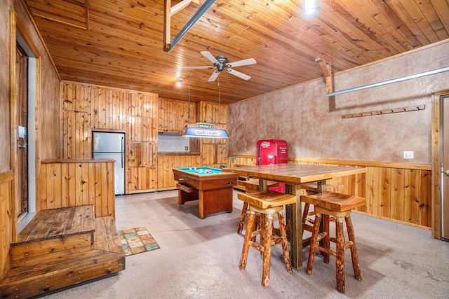 recreation room with ceiling fan, wood walls, wooden ceiling, and pool table