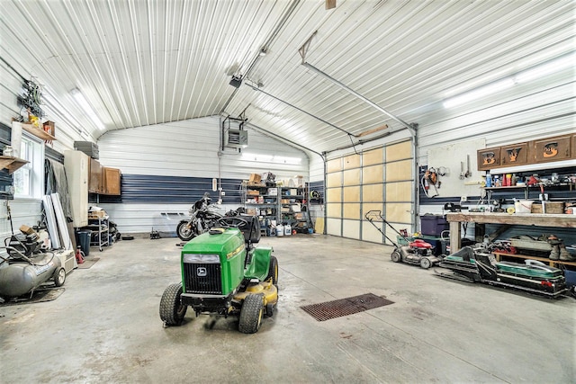 garage featuring a workshop area and a garage door opener