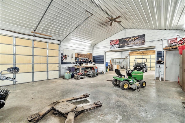 garage with a workshop area and ceiling fan