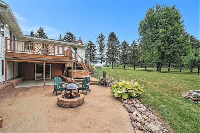 view of patio featuring an outdoor fire pit and a wooden deck